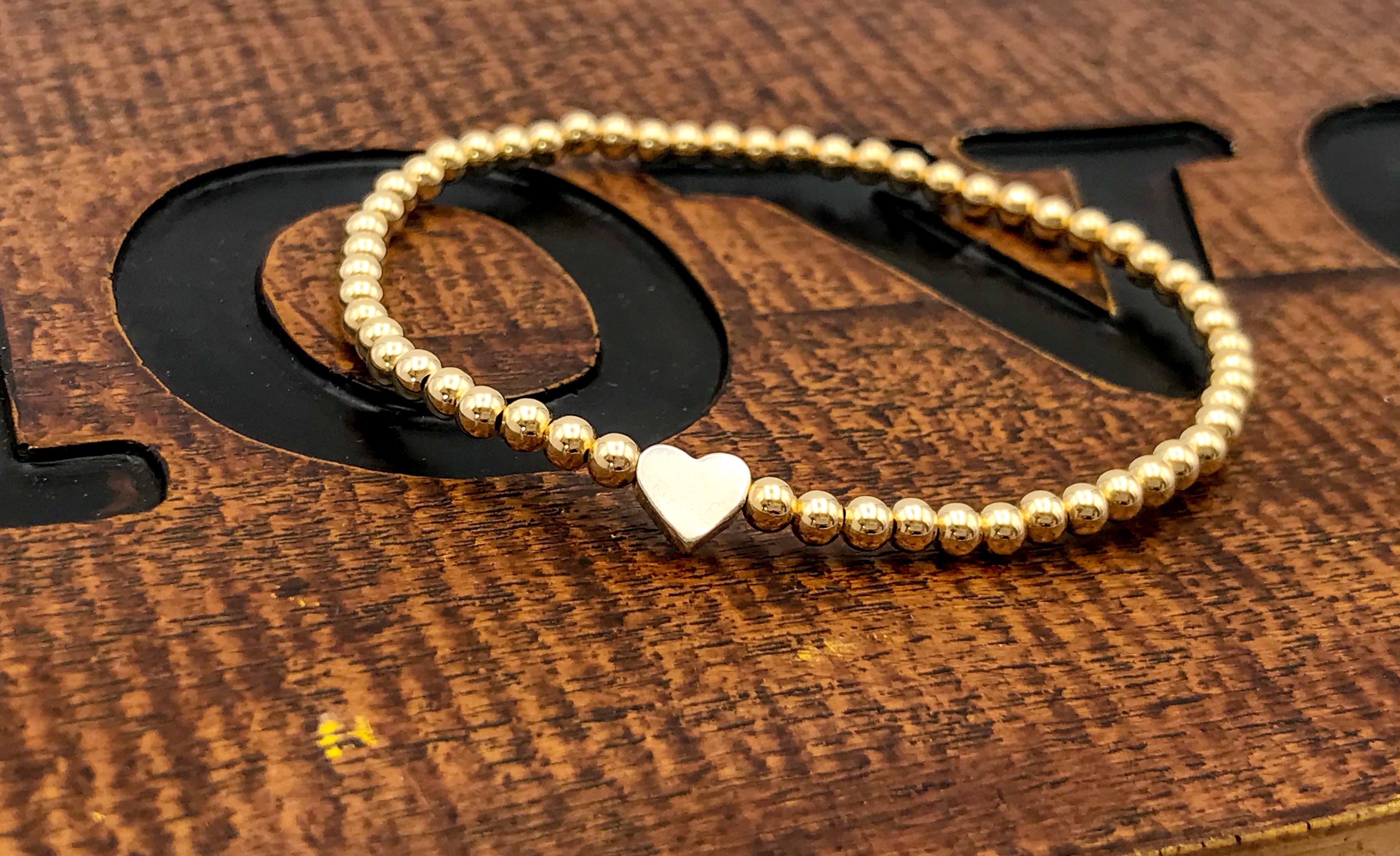 Silver bead bracelet on sale with heart charm